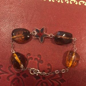 Amber and natural flower in star design.